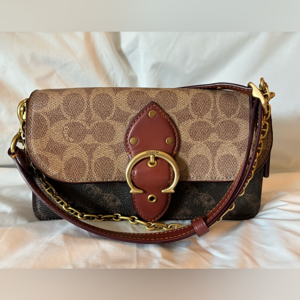 Coach Beat crossbody clutch in signature C and horse and carriage C0831.  NWOT
